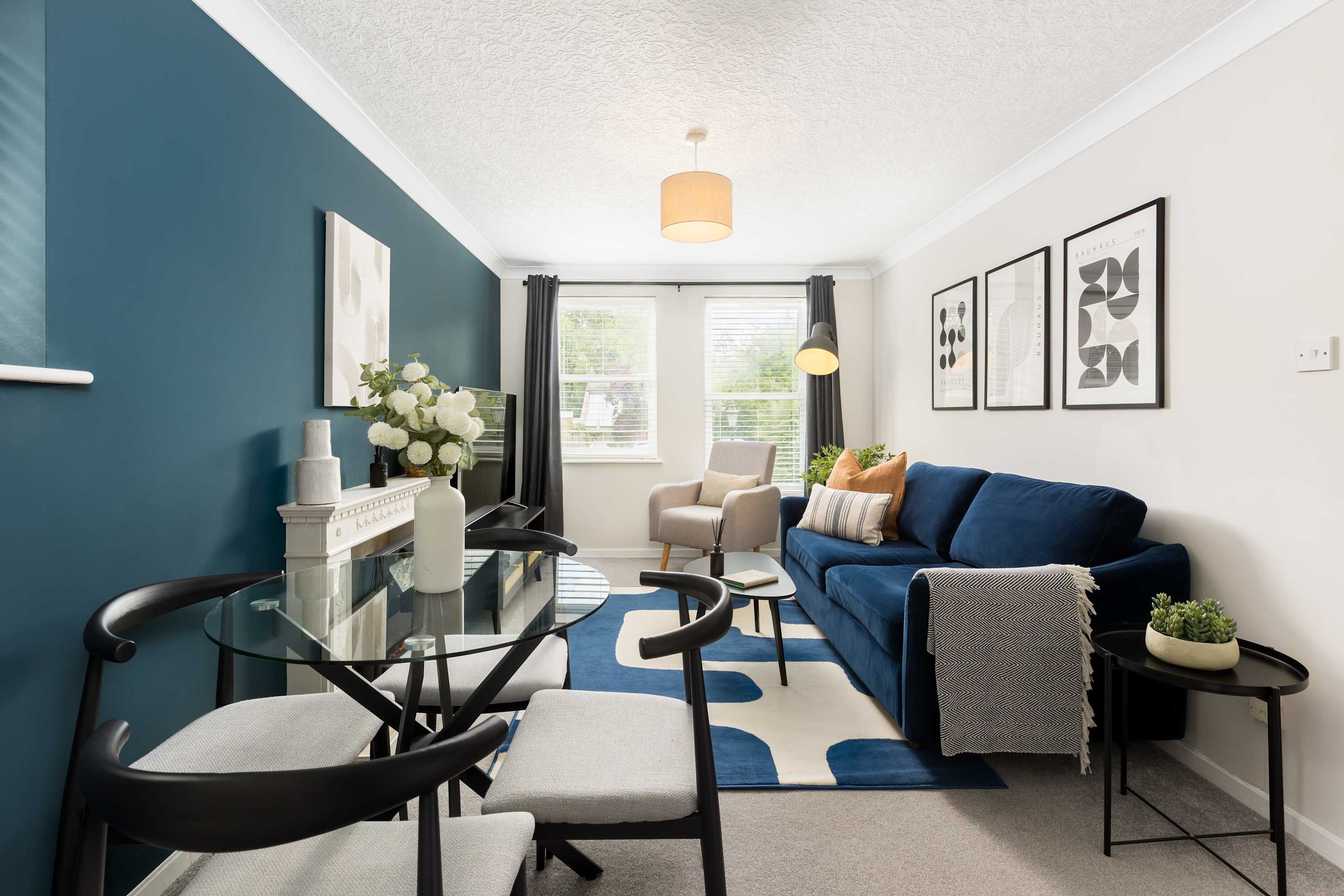 A teal-walled living and dining room in a Leamington Spa apartment we manage