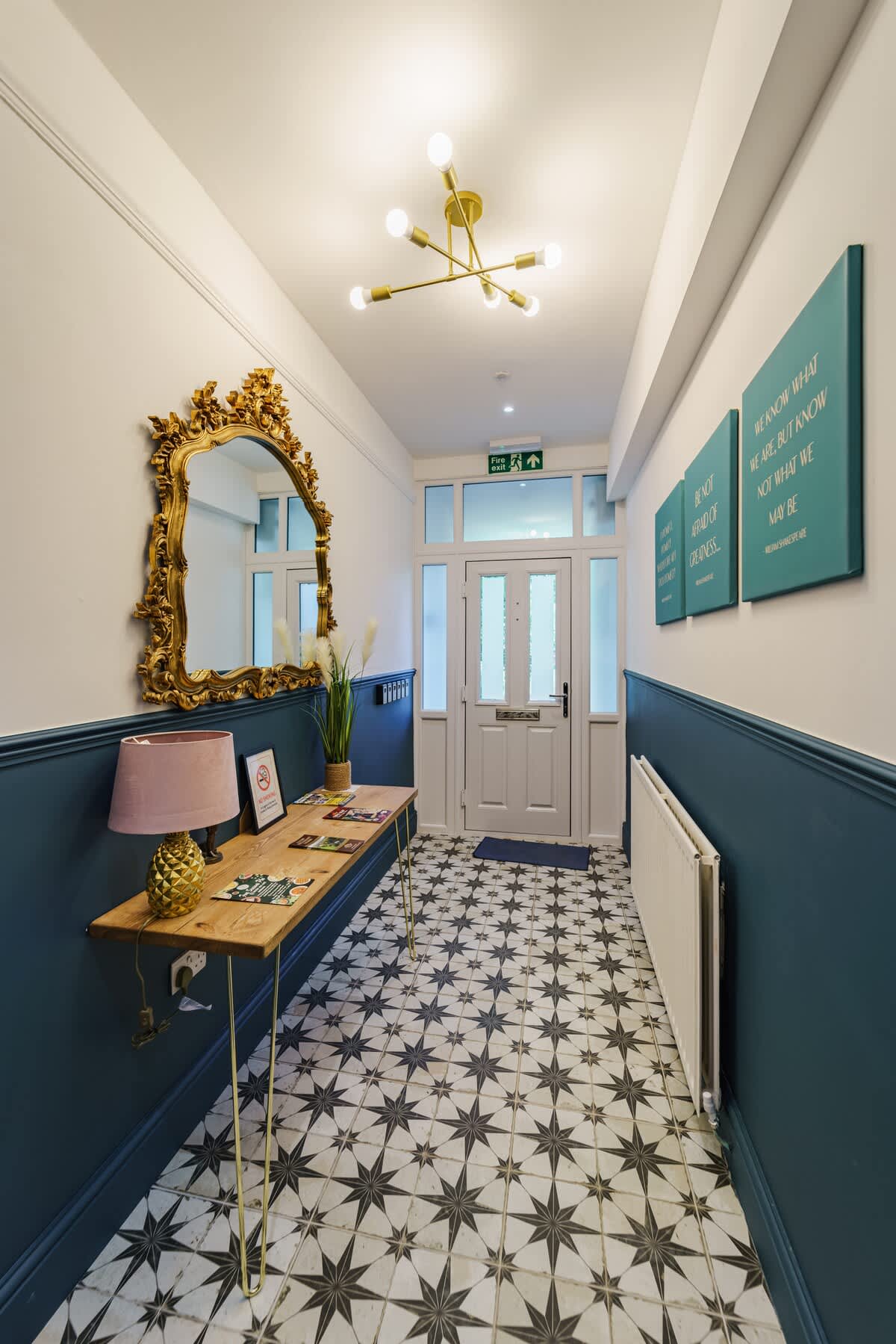 The entrance hall at The Adelphi, with its tiled floor and gilt mirror