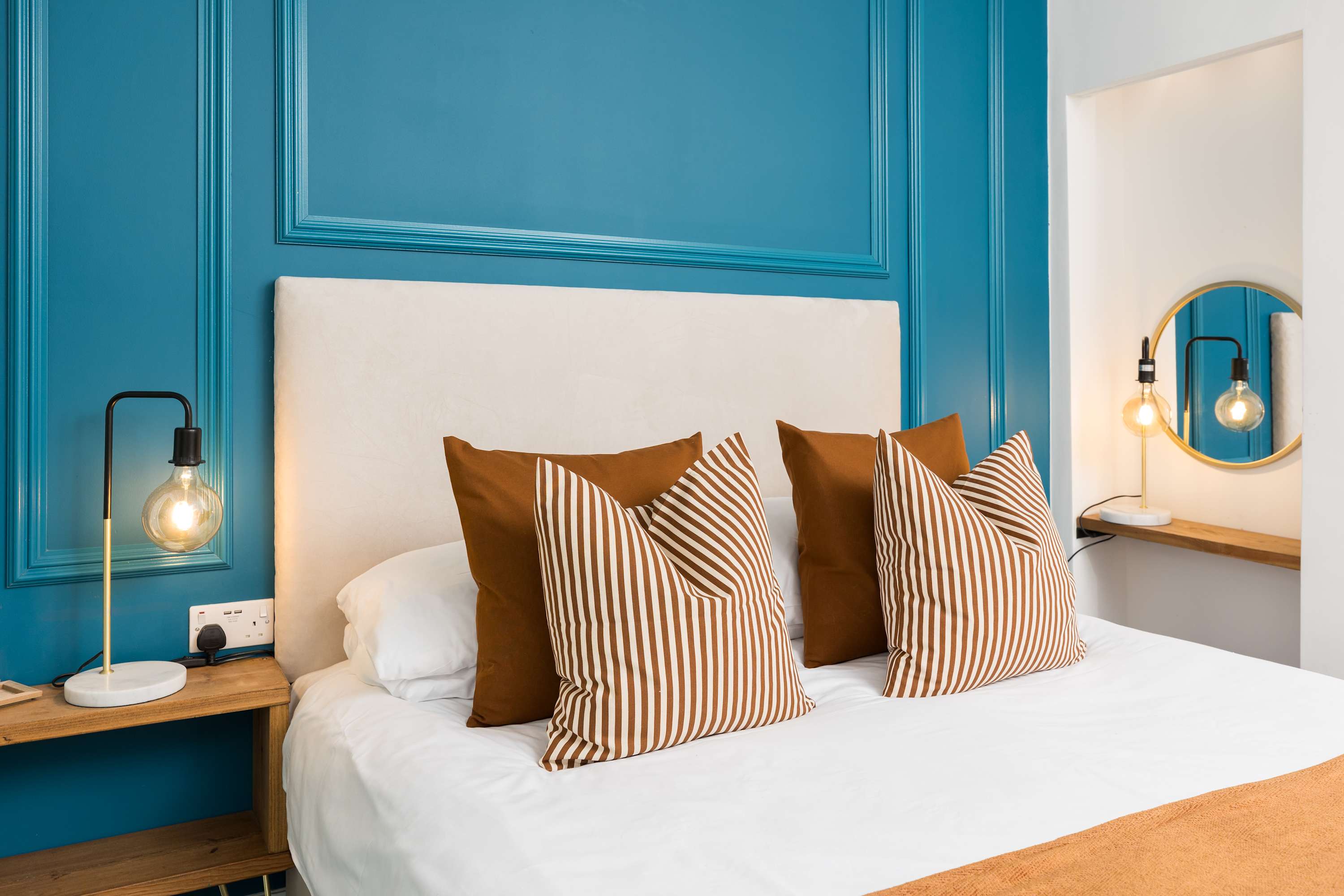 A studio at The Adelphi with a teal panelled wall